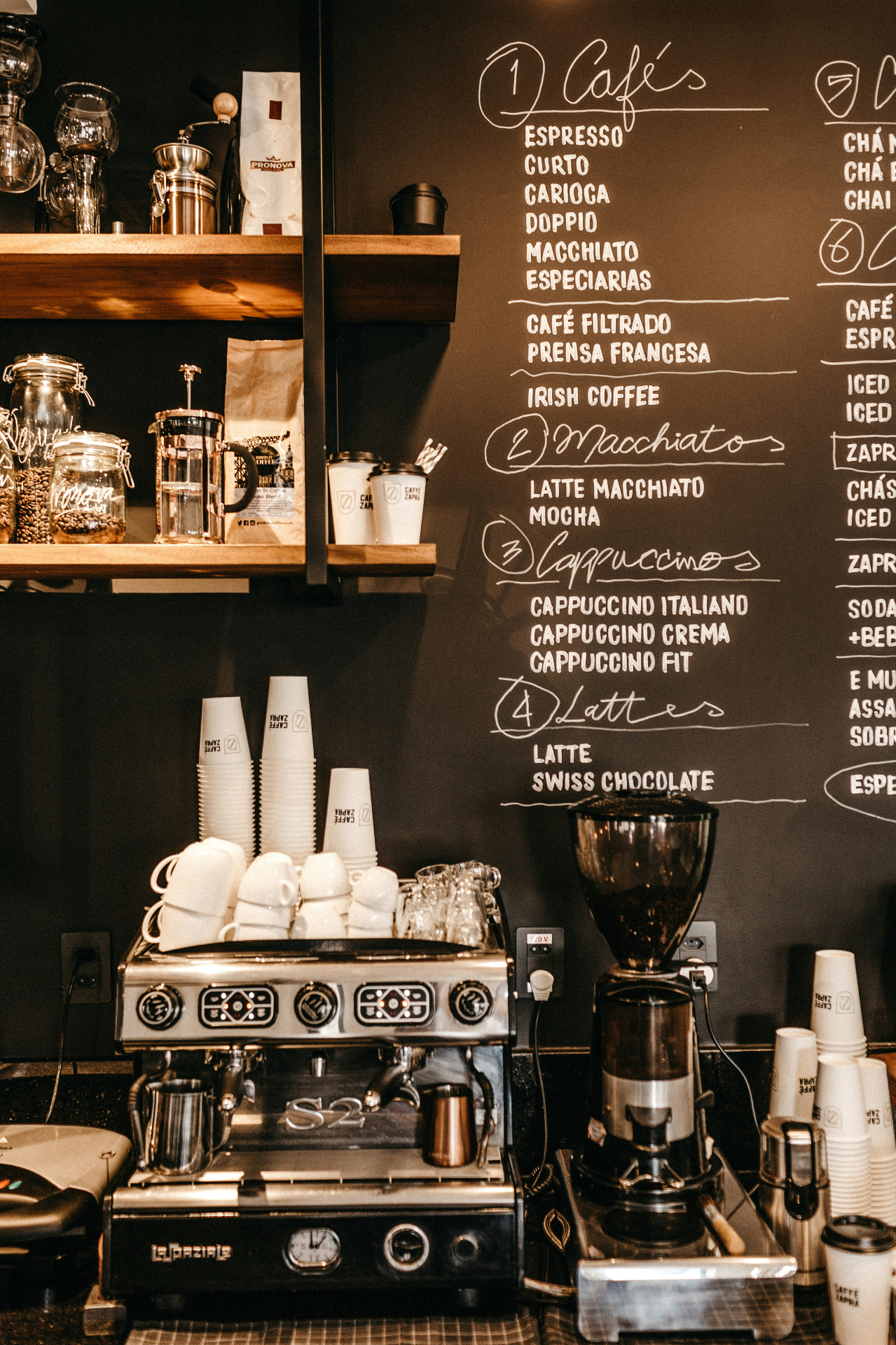 Coffee shop counter with espresso machine and menu board